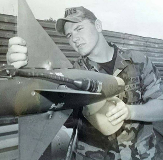 Locke inspects an AIM-9 missile while serving in the Air Force. Locke inspects an AIM-9 missile while serving in the Air Force.
