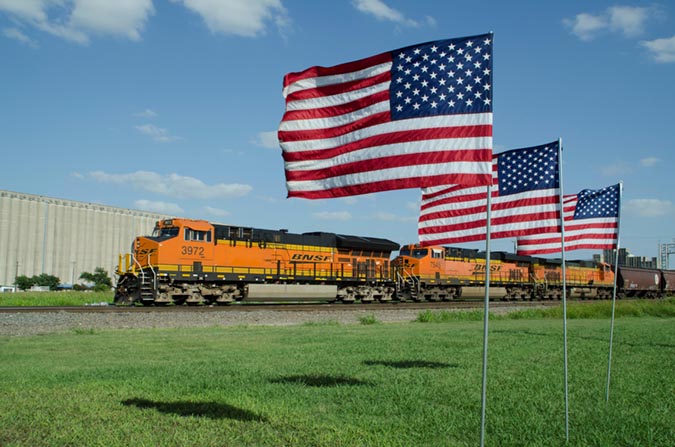 BNSF 3972, a Tier 4 ET44C4 locomotive, hauls grain in Saginaw, Texas.