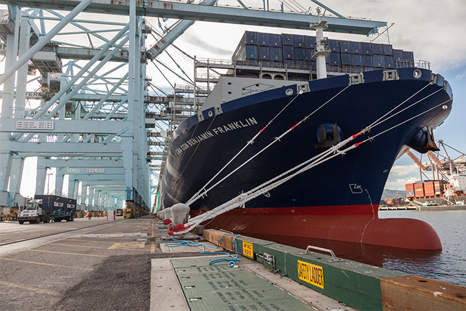 Unloading of docked container ship at Port of Los Angeles 