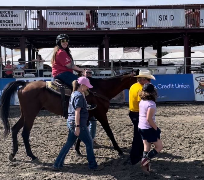 Cassie McCord on a horse during a Rascal Rodeo event